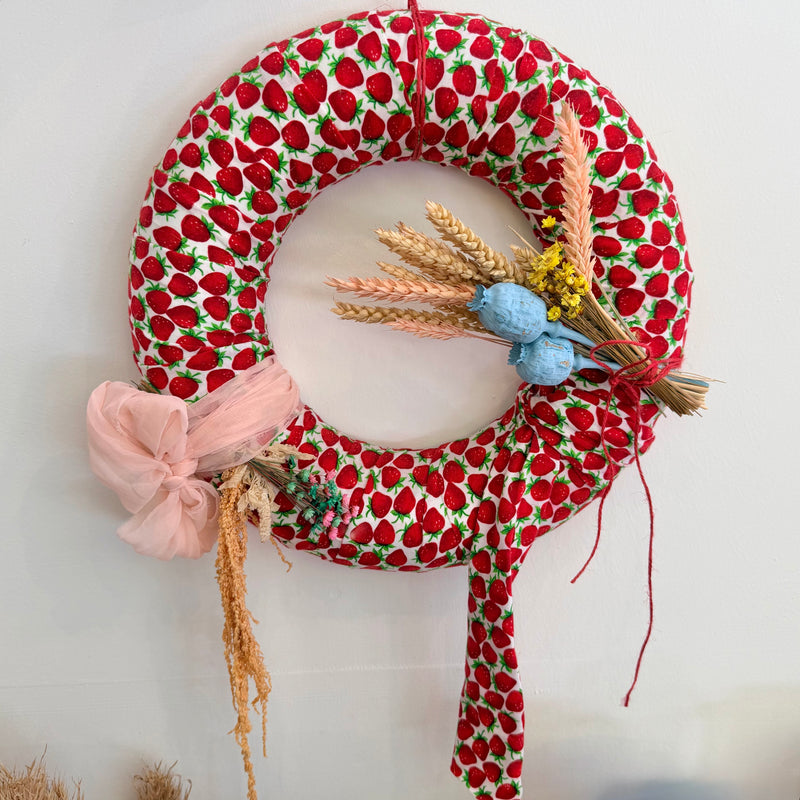 Wreath wrapped with strawberry fabric