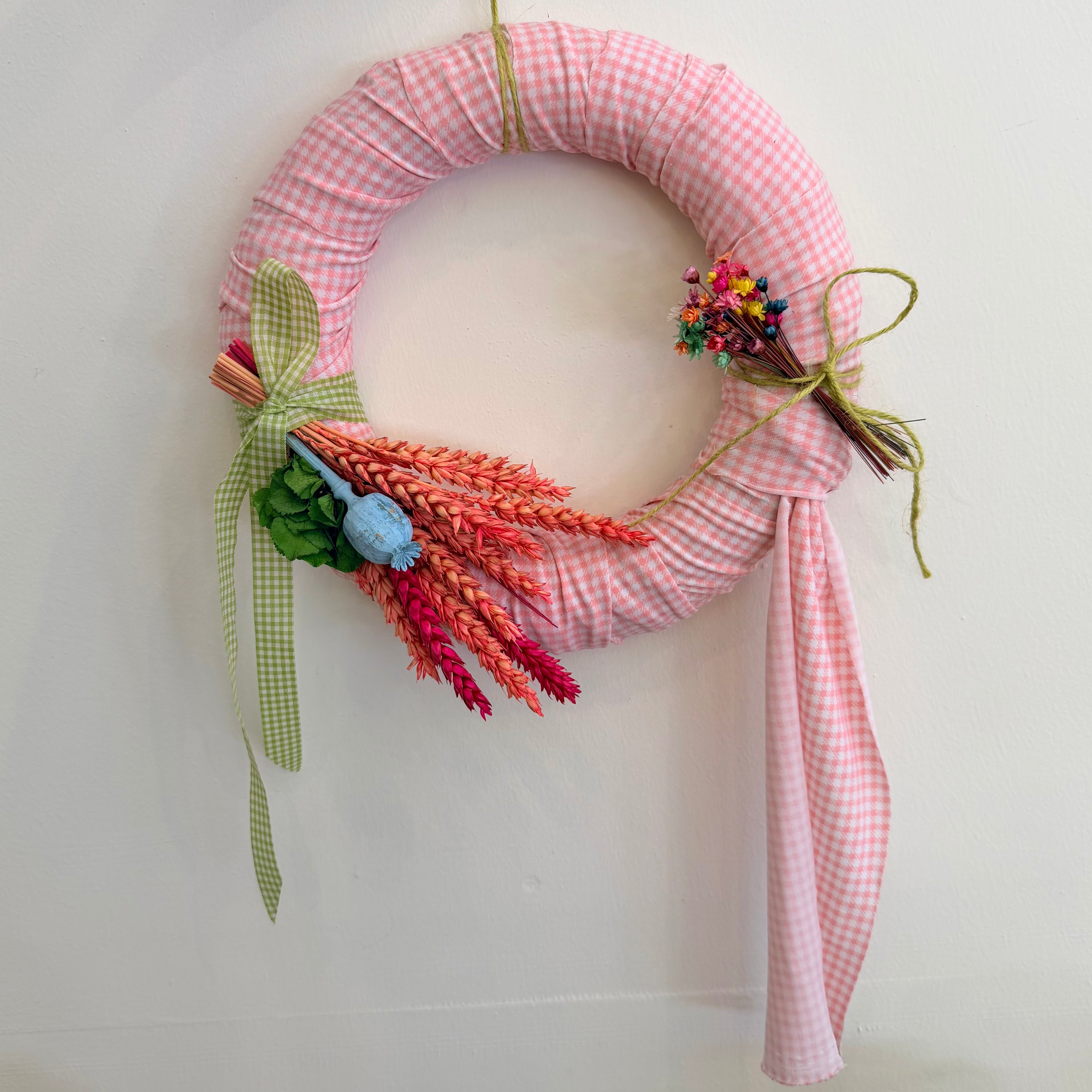 Wreath wrapped with pink fabric