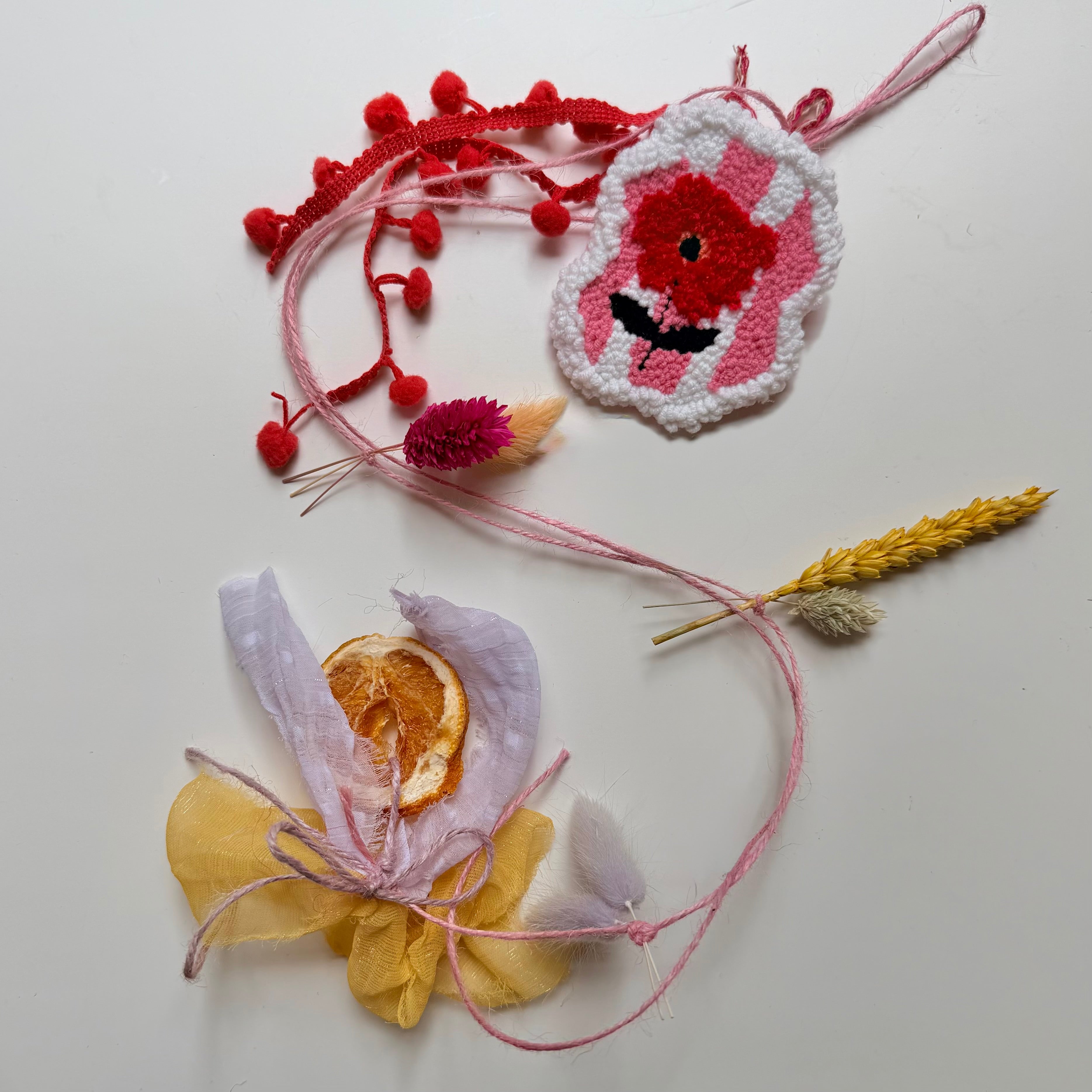 Spring garland with embroidered poppy