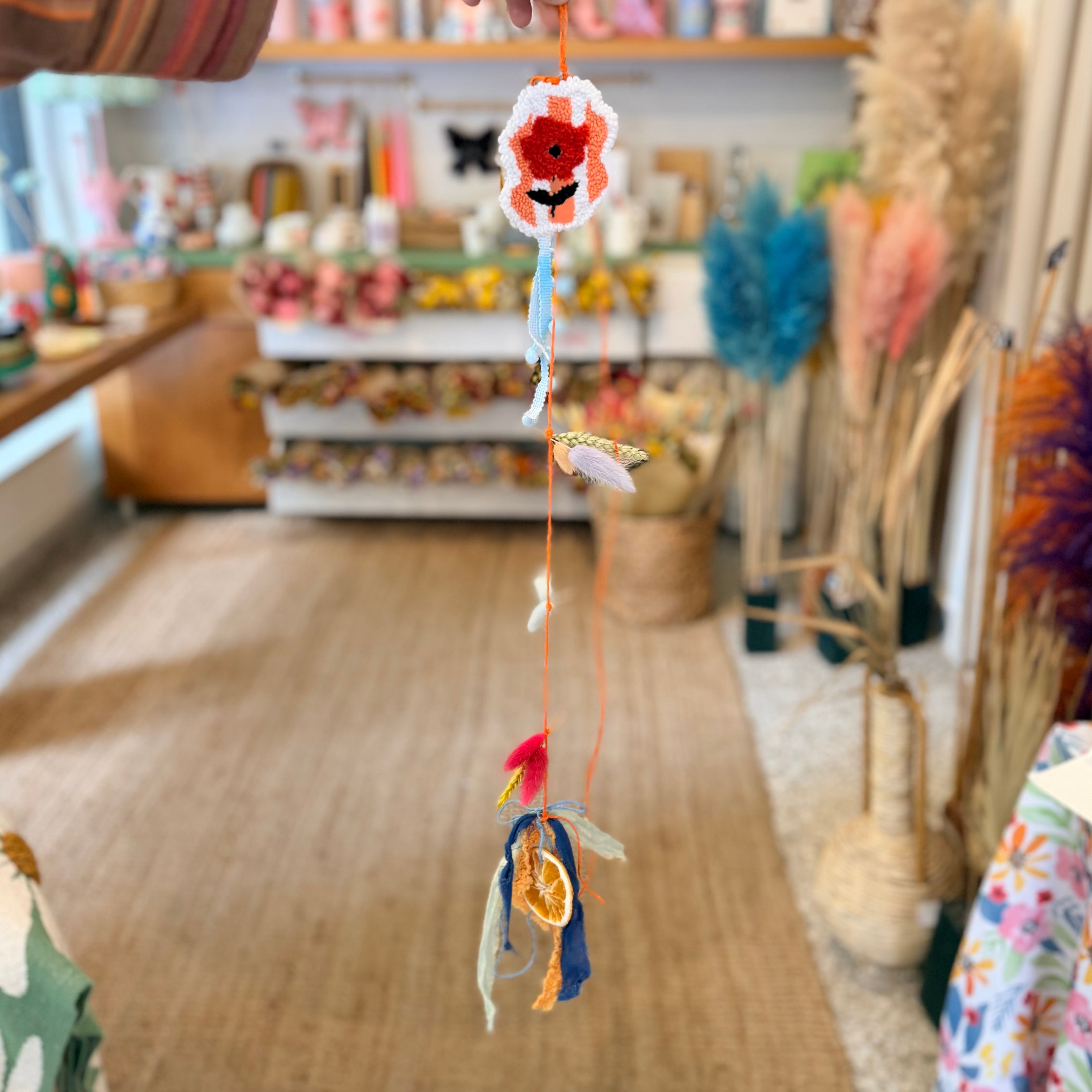 Spring garland with embroidered poppy