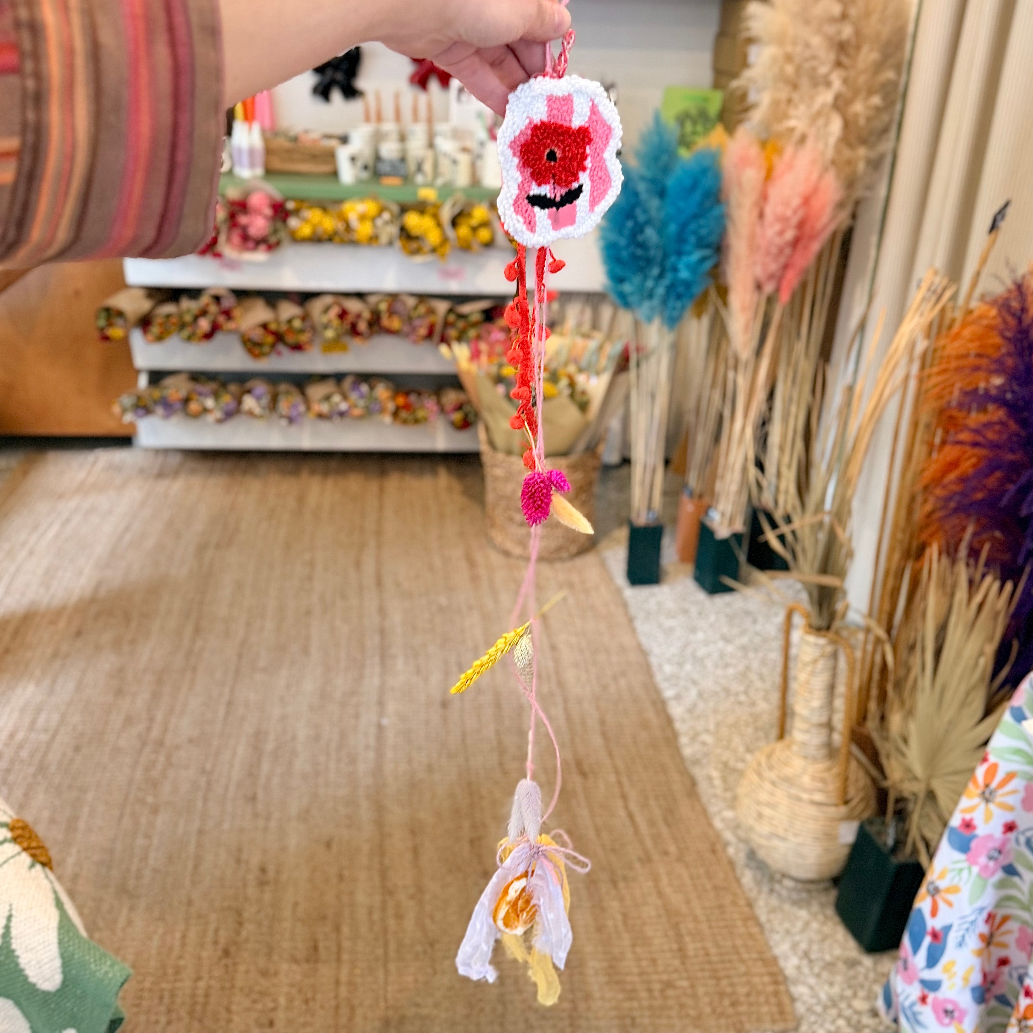 Spring garland with embroidered poppy