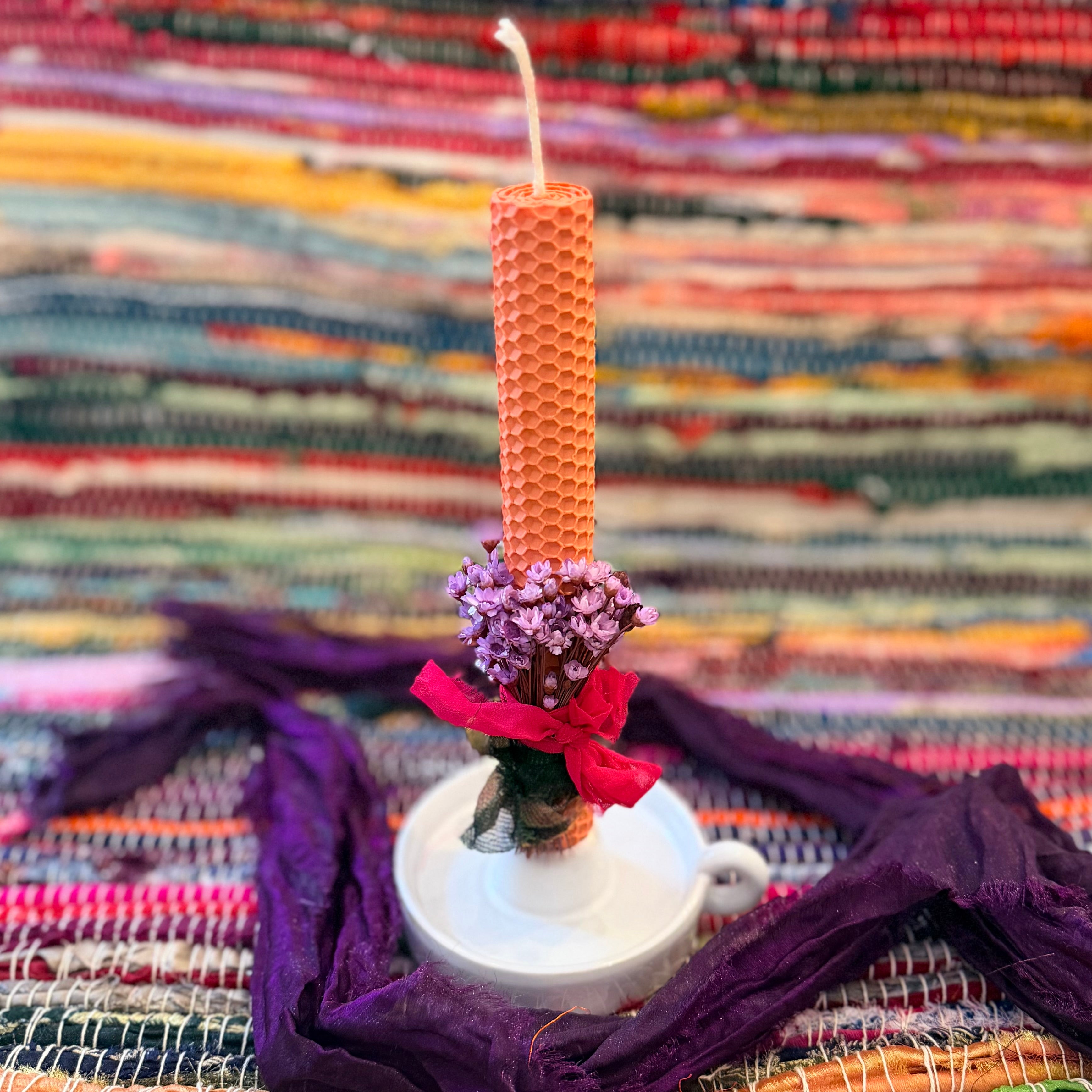 Beeswax candle with lilac bouquet
