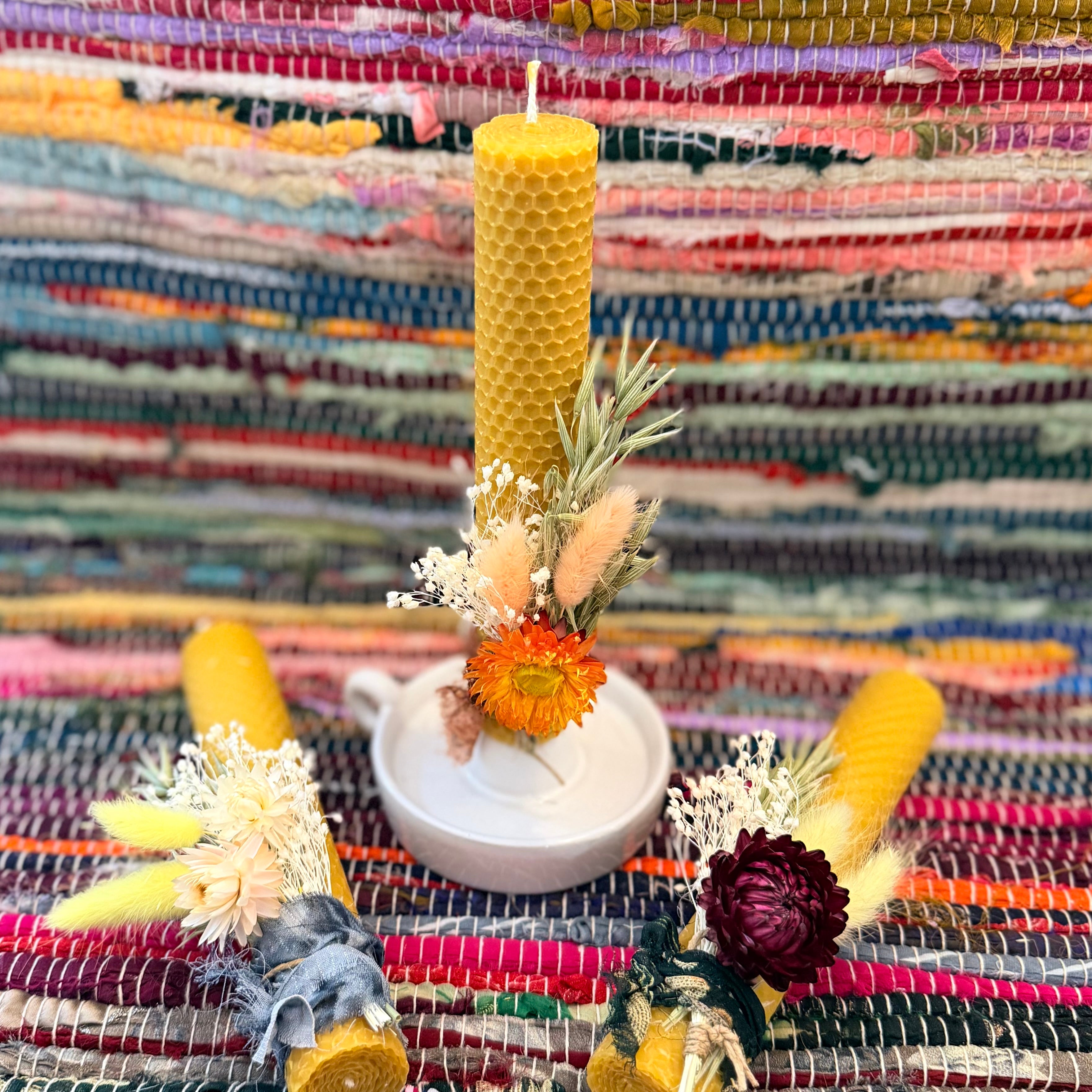 Beeswax candle with dried helichrysum